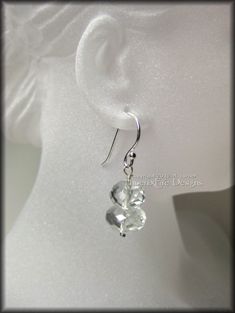 mint-ice-earrings1a Gorgeous microfaceted mystic quartz rondelles in a beautiful pale mint color are stacked on .925 sterling silver pins and dangle from .925 ear wires.