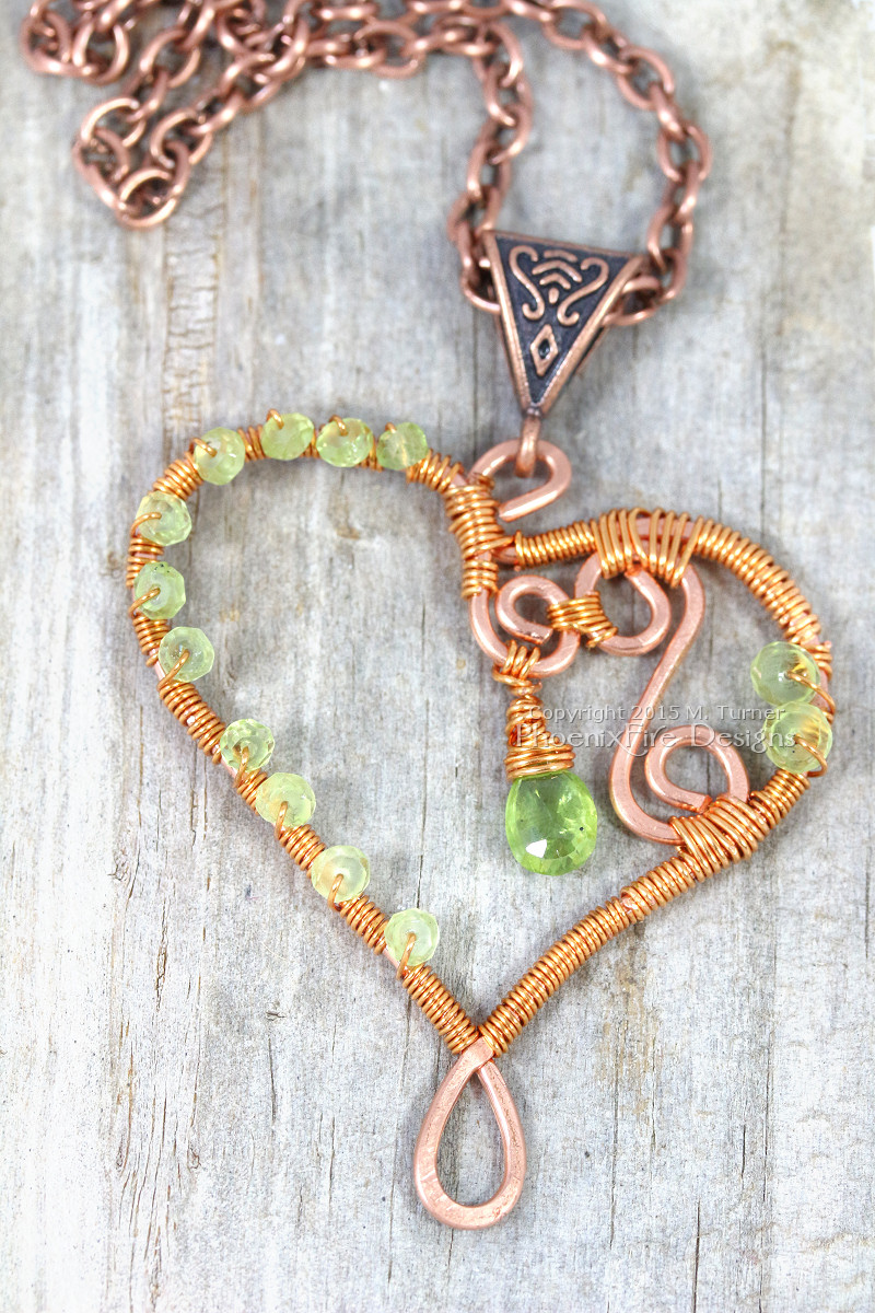 Wire wrapped heart pendant in copper wire with peridot birthstone gemstones, Celtic design bail and antique copper chain with spirals and swirls handmade by PhoenixFire Designs on etsy.