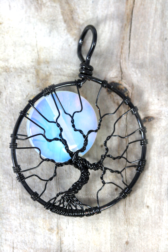 Handcrafted black wire wrapped opalite rainbow moonstone full moon tree of life pendant - the best seller by PhoenixFire Designs on etsy.