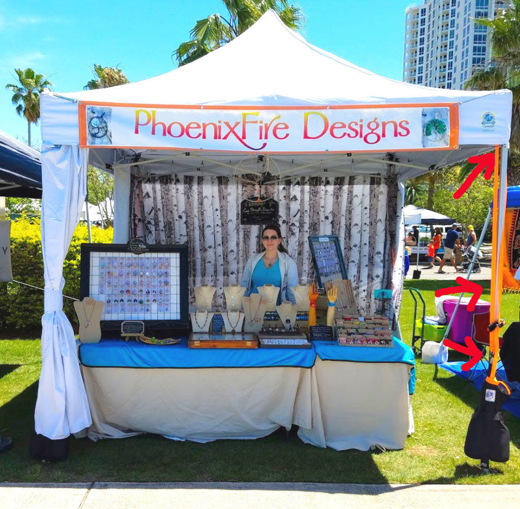 Demonstration of how to use tent bag weights and ratchet tie down straps to secure your vendor tent at shows.