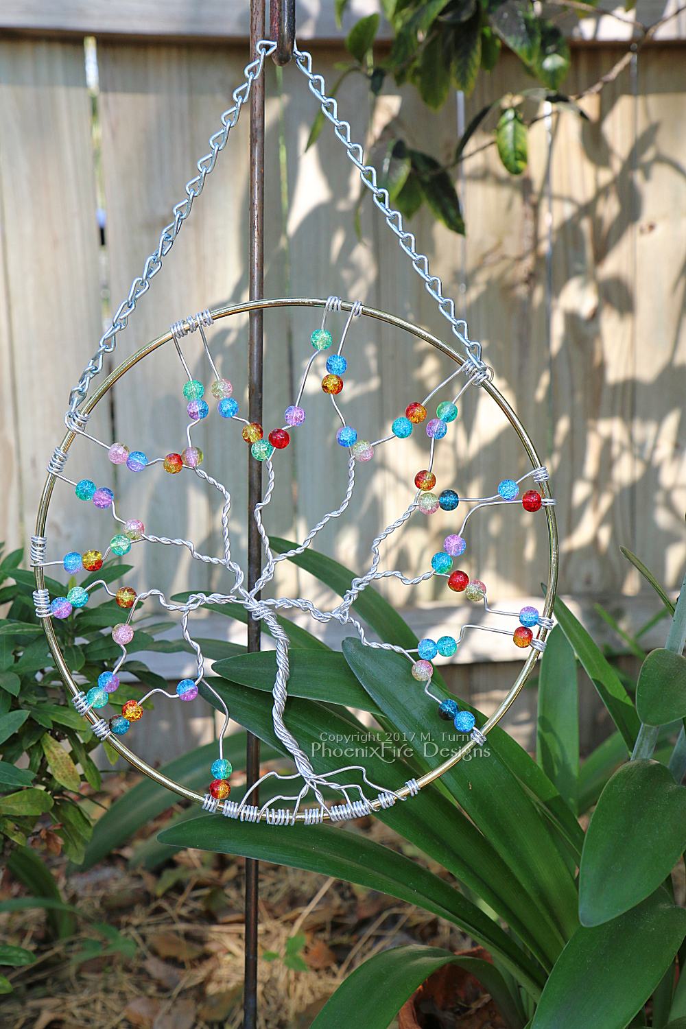 Silver anodized aluminum wire wrapped tree of life 8" suncatcher with rainbow glass fire cracked beads, perfect garden art, or handmade wall art for your home. By PhoenixFire Designs.